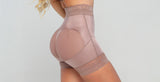 Close-up of woman wearing a shaping butt lifter to enhance her curves.
